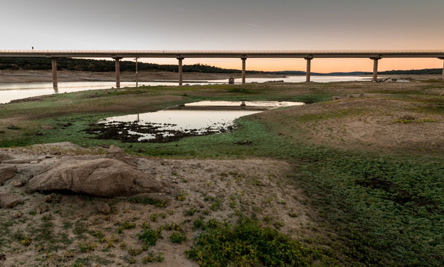 Irrigation reservoir near Madrid with low water level due to a drought period, Spain